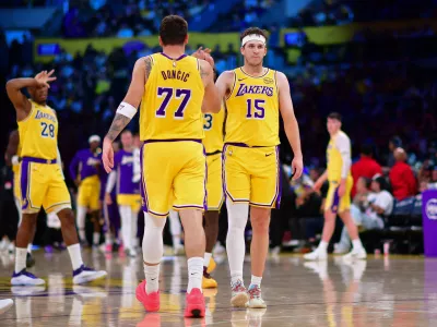 Mar 12, 2026; Los Angeles, California, USA; Los Angeles Lakers guard Luka Doncic (77) and guard Austin Reaves (15) react during the second half at Crypto.com Arena. Mandatory Credit: Gary A. Vasquez-Imagn Images