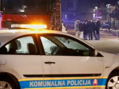 Police and security personnel stand on a street in front of a firetruck near the scene where a gunman opened fire at a restaurant and killed several people in Cetinje, Montenegro, January 1, 2025. REUTERS/Stevo Vasiljevic