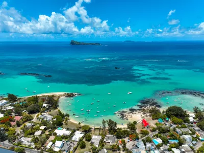 Aerial view of Cap Malheureux, Mauritius showing homes near vibrant reefs