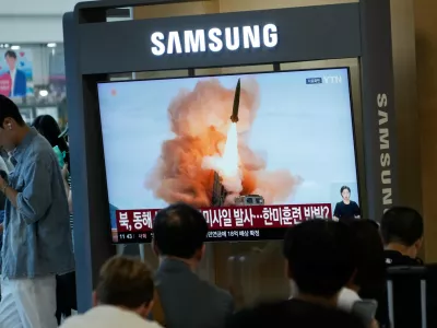 A TV screen shows a file image of North Korea's missile launch during a news program at Seoul Railway Station in Seoul, South Korea, Wednesday, Aug. 12, 2026. (AP Photo/Ahn Young-joon)