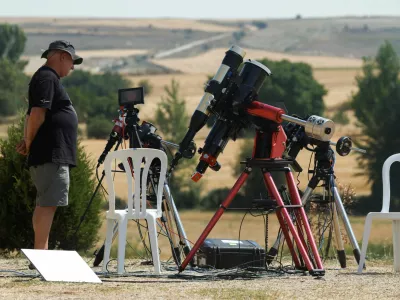A member of the Exploratorium team, a science, technology and arts museum in San Francisco, stands by telescopes as he prepares to observe a solar eclipse in Villalibado, Spain, August 12, 2026. REUTERS/Jon Nazca