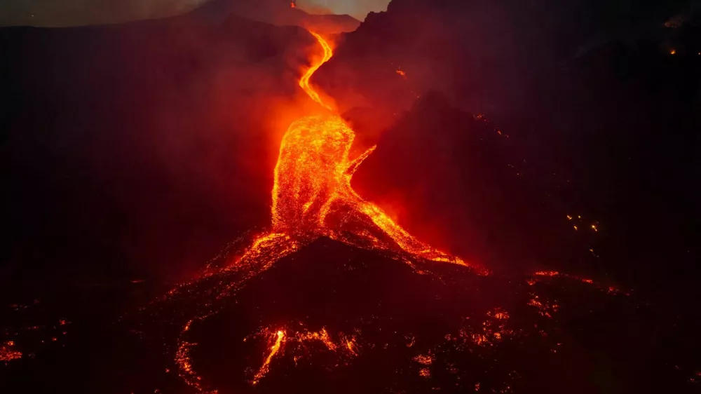 A drone view shows molten lava flowing down the slope during an eruption at Mount Etna in Sicily, Italy, August 11, 2026. Giuseppe Di Stefano/Etna Walk/via REUTERS  ATTENTION EDITORS - THIS IMAGE WAS PROVIDED BY A THIRD PARTY.   TPX IMAGES OF THE DAY