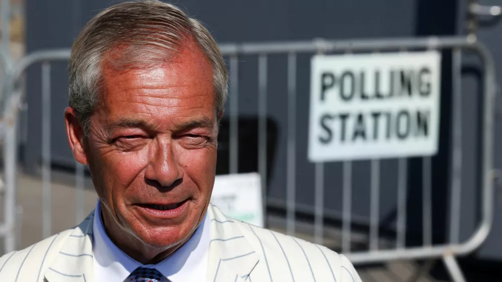 Britain's Reform UK party leader Nigel Farage outside a polling station on the day of the Clacton by-election, triggered by his own resignation, in Walton-on-the-Naze, Essex, Britain, August 13, 2026. REUTERS/Toby Shepheard