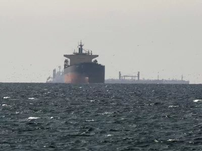 FILE PHOTO: FILE PHOTO: Cargo ships in the Gulf, near the Strait of Hormuz, as seen from northern Ras al-Khaimah, near the border with Oman's Musandam governance, amid the U.S.-Israeli conflict with Iran, in United Arab Emirates, March 11, 2026. REUTERS/Stringer/File Photo