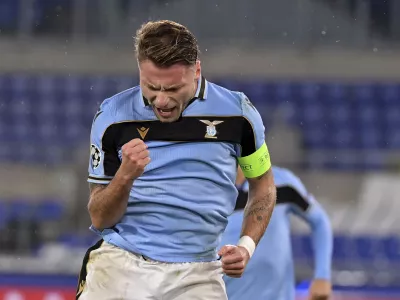 Lazio's Ciro Immobile celebrates after scoring his side's 2nd goal, during the Champions League, group F soccer match between Lazio and Club Brugge, at the Rome Olympic Stadium, Tuesday, Dec. 8, 2020. (Alfredo Falcone/LaPresse via AP)