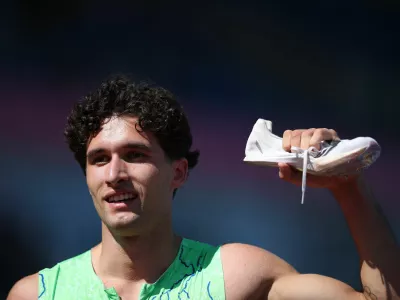 Athletics - European Athletics Championships - Alexander Stadium, Birmingham, Britain - August 12, 2026 Second place Slovenia's Matic Ian Gucek poses with his spike after the men's 400m hurdles semi final 3 REUTERS/Andrew Boyers