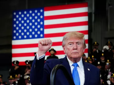 President Donald Trump gestures after speaking at the David Mack Center for Training and Intelligence, Friday, Aug. 14, 2026, in Garden City, N.Y. (AP Photo/Julia Demaree Nikhinson)