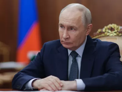 Russian President Vladimir Putin listens to the Governor of Nenets Autonomous Area Irina Gekht during their meeting at the Kremlin in Moscow, Monday, Aug. 17, 2026. (Mikhail Metzel, Sputnik, Kremlin Pool Photo via AP)
