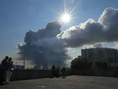 FILE - Smoke rises following a Ukrainian drone strike on a warehouse belonging to online retailer Wildberries, in St. Petersburg, Russia, on Friday, July 24, 2026. (UGC via AP, File)