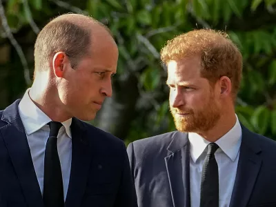 FILE - Britain's Prince William and Britain's Prince Harry walk beside each other after viewing the floral tributes for the late Queen Elizabeth II outside Windsor Castle, in Windsor, England on Sept. 10, 2022. (AP Photo/Martin Meissner, File)