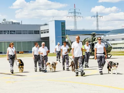 Rescue dogs are gently introduced to a H145 recue helicopeter at Donauw&ouml;rth, the German headquarters of Airbus Helicopters. //Life-saving sniffer dogs are seen overcoming their fear of rescue helicopters during vital training. Aircraft manufacturer Airbus helps canine units get used to the sound, vibrations and downwash of the rotors so they can travel to the areas where they are needed. The initially nervous dogs of the Nordschwaben District Association of the Bavarian Red Cross are introduced to a H145 aircraft at Donauw&ouml;rth, the German headquarters of Airbus Helicopters. They are then taken to the helicopter while the rotors are turning to get used to the sensations. Airbus said Friday (14/8): "The vibrations and downwash of the rotor unsettle the dogs. The closer they get, the more they cower. All that can help now are kind words from their human partner and a few treats from their pockets at the right moment. When the rescue teams go on search missions, there are usually helicopters in the air, flying over the area, which is why the dogs need to overcome their fear of them." Airbus said that five dogs took part &ndash; Miko, Odin, Bella, Mia and Hugo &ndash; with four overcoming their fear. It added: "But that's not a problem, since area search dogs don't normally fly with the helicopter. They are deployed in locations where the terrain can also be accessed by car."Photo released 19/08/2026,Image: 1125881857, License: Rights-managed, Restrictions: Editorial use, commercial use may require additional licenses. We don't use AI to make images which could be mistaken for news photos. AI use will be clearly indicated. Supplied on condition you ensure personal data is processed in compliance with UK GDPR, Model Release: no 