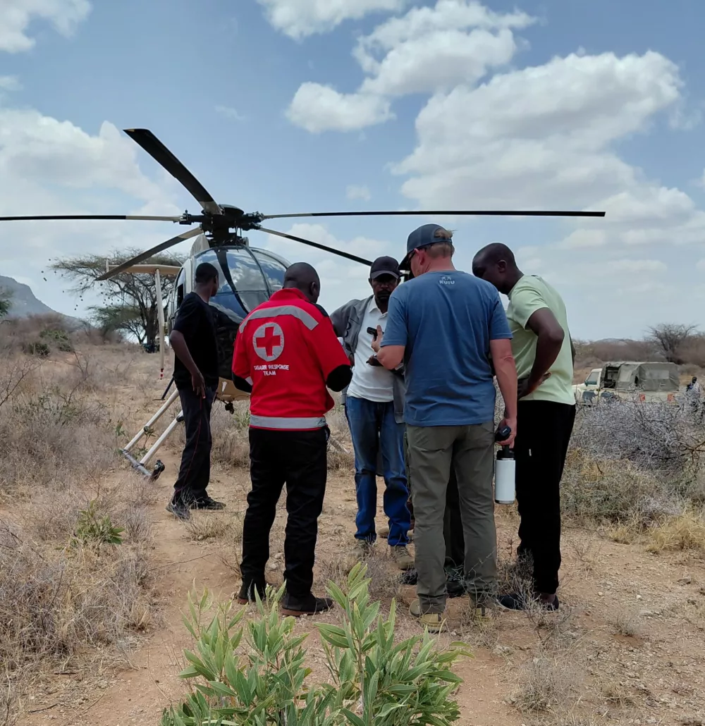 Rescue officials work at the site of a tourist helicopter crash that caused multiple casualties, according to the police, in Samburu County, Kenya, August 19, 2026. Kenya Red Cross/Handout via REUTERS  THIS IMAGE HAS BEEN SUPPLIED BY A THIRD PARTY. NO RESALES. NO ARCHIVES. MANDATORY CREDIT.