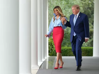 President Donald Trump, right, and first lady Melania Trump walk to attend an event in the Rose Garden of the White House, Thursday, Aug. 20, 2026, in Washington. (AP Photo/Jacquelyn Martin)