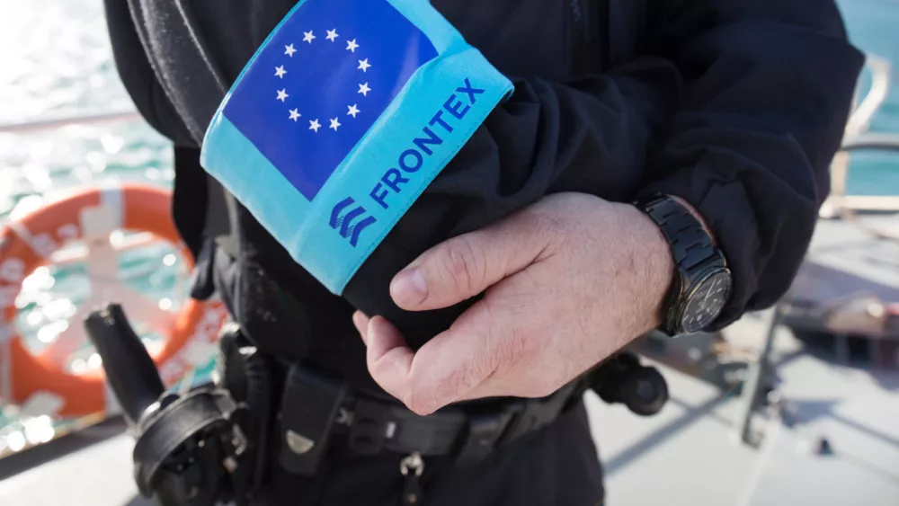 FILED - 01 March 2016, Greece, Vathi: A police officer of the EU border protection agency Frontex stands on the foredeck of a patrol boat in the port of the island of Samos. The&nbsp;European Union's second-highest court has dismissed a case brought by a Syrian family asking for damages against the bloc's border agency Frontex over alleged human rights abuses. Photo: Christian Charisius/dpa