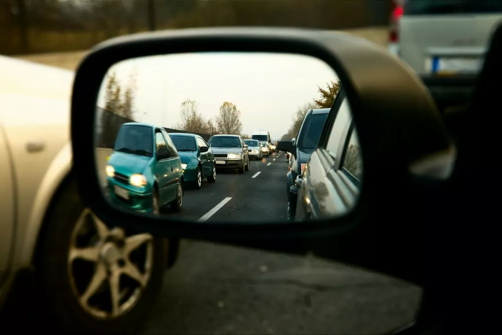 Traffic jam in the sideview mirror of a car,Image: 169952198, License: Royalty-free, Restrictions:, Model Release: no