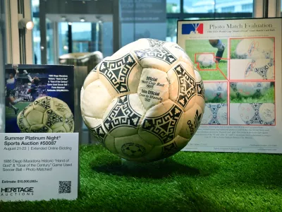 The ball that was used in the 1986 World Cup match between Argentina and England during which Argentina's Diego Maradona scored the "Hand of God" goal is displayed before auction at Heritage Auctions in Beverly Hills, California, on August 7, 2026. The ball that Maradona used to score his infamous "Hand of God" goal is expected to sell for  million at a US auction this month. Maradona's goal in the quarter-final match at the Estadio Azteca saw him punch the ball past the England goalkeeper, with the South Americans ultimately winning 2-1.,Image: 1121403624, License: Rights-managed, Restrictions:, Model Release: no 