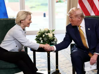 FILE PHOTO: U.S. President Donald Trump shakes hands with European Commission President Ursula von der Leyen, after an announcement of a trade deal between the U.S. and EU, in Turnberry, Scotland, Britain, July 27, 2025. REUTERS/Evelyn Hockstein/File Photo
