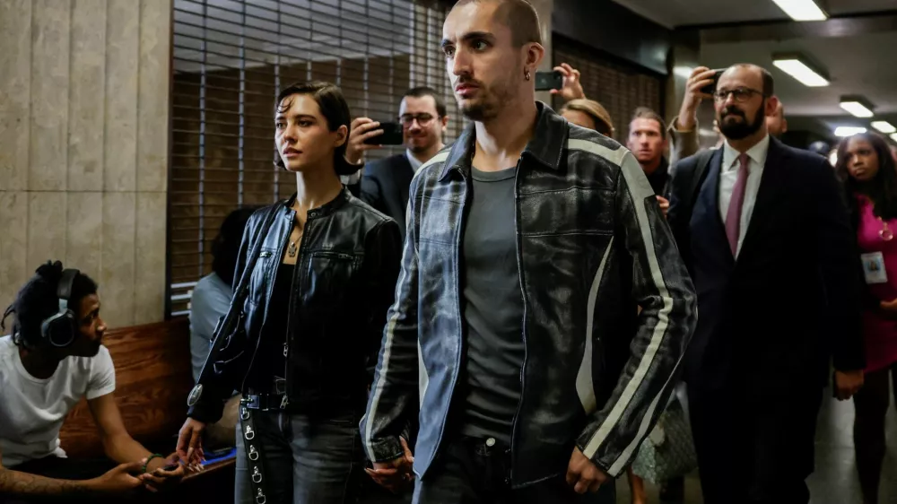 Angela Nikolau and Ivan Kuznetsov, who climbed the Empire State Building, leave court in New York City, U.S., August 24, 2026. REUTERS/Jeenah Moon