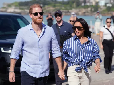 FILE - Prince Harry, and Meghan, the Duke and Duchess of Sussex, arrive for an event, during a visit to Bondi Beach, Australia, April 17, 2026. (Jonathan Brady/Pool Photo via AP, File)
