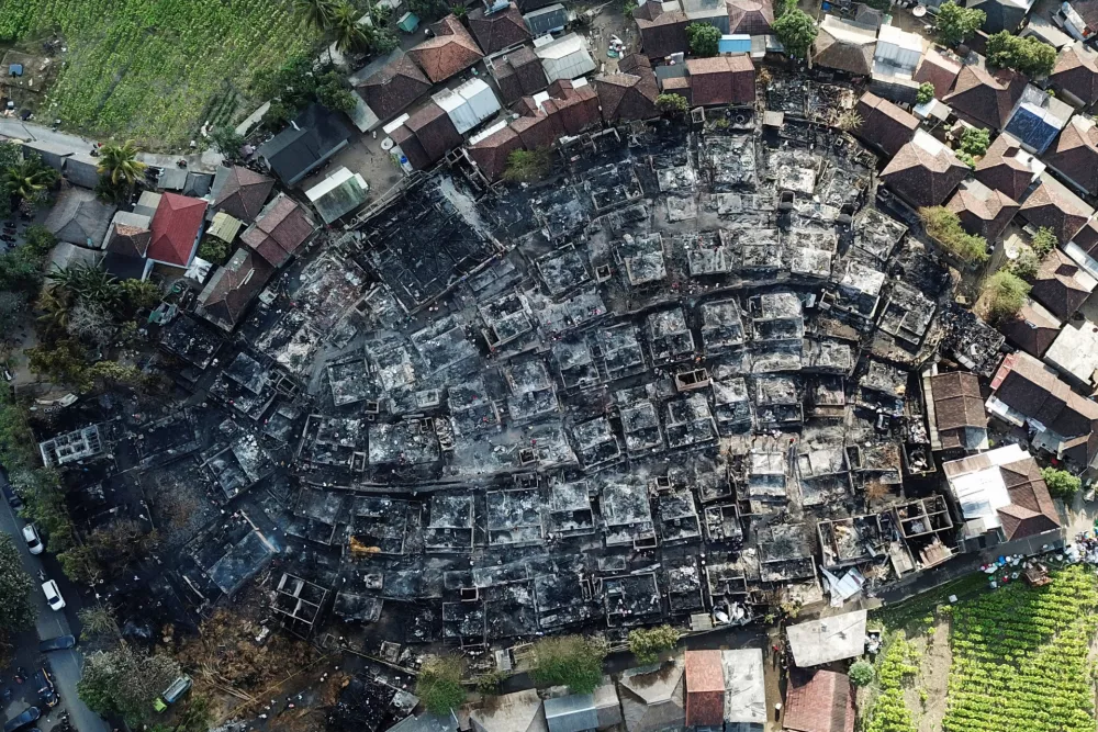 A drone view shows the aftermath of a fire at Sade, a traditional Sasak village that caught fire overnight in Lombok, West Nusa Tenggara province, Indonesia, August 23, 2026. REUTERS/Stringer