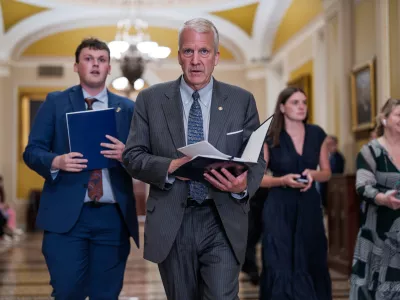 Sen. Dan Sullivan, R-Alaska, heads to a closed-door meeting with fellow Republicans, at the Capitol in Washington, Tuesday, June 2, 2026. (AP Photo/J. Scott Applewhite)