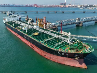 A cargo ship unloads imported crude oil at the oil terminal of Qingdao Port in Qingdao, east China's Shandong province, July 30, 2026.No Use China. No Use France.