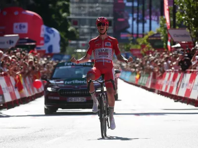 Cycling - Vuelta a Espana - Stage 4 - Andorra la Vella to Andorra la Vella - Andorra la Vella, Andorra - August 25, 2026 UAE Team Emirates - XRG's Tadej Pogacar celebrates as he crosses the line to win stage 4 REUTERS/Bruna Casas
