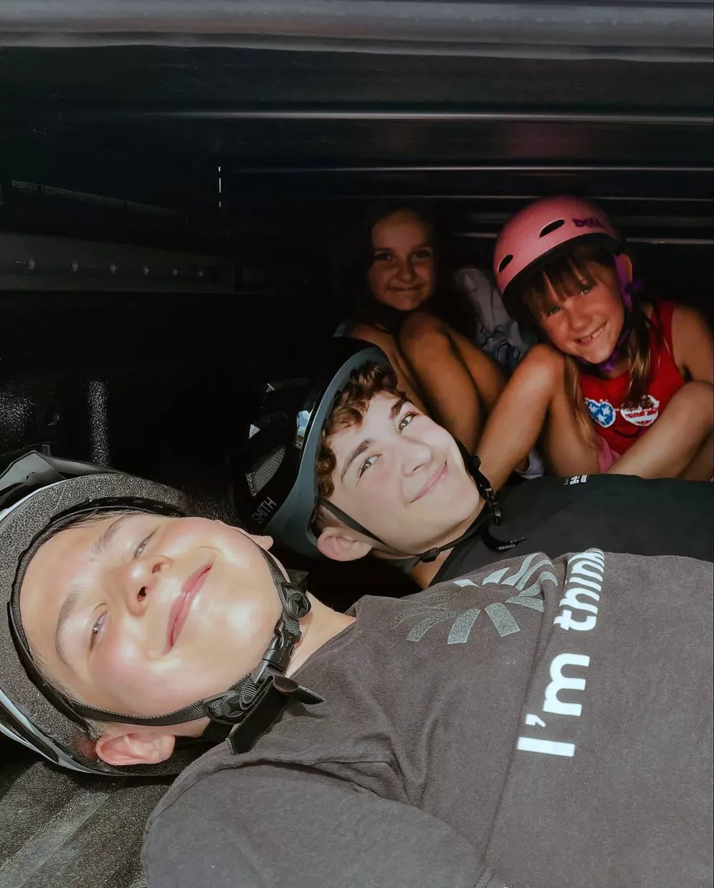 This undated photo provided by Erica Schneider shows, Owen Ireland, front, Landon Ghekiere, center, Charlotte Ghekiere, back left, and Chloe Ireland, back right in helmet. (Erica Schneider via AP)