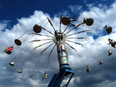 A rotating carousel on the blue sky