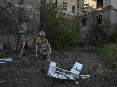 Servicemen of the Unmanned Systems Unit of Special Rifle Police Battalion inspect a shot down Russian combat drone, amid Russia's attack on Ukraine, in the frontline town of Druzhkivka, in Donetsk region, Ukraine August 24, 2026. REUTERS/Stringer