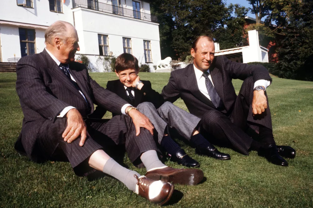 From left, Norway's King Olav, his nephew Crown Prince Haakon, and his son Crown Prince Harald, sit in front of the royal residence of Skaugum, in Asker, Norway, on Sept. 17, 1982.(Erik Thorberg/NTB Scanpix via AP)