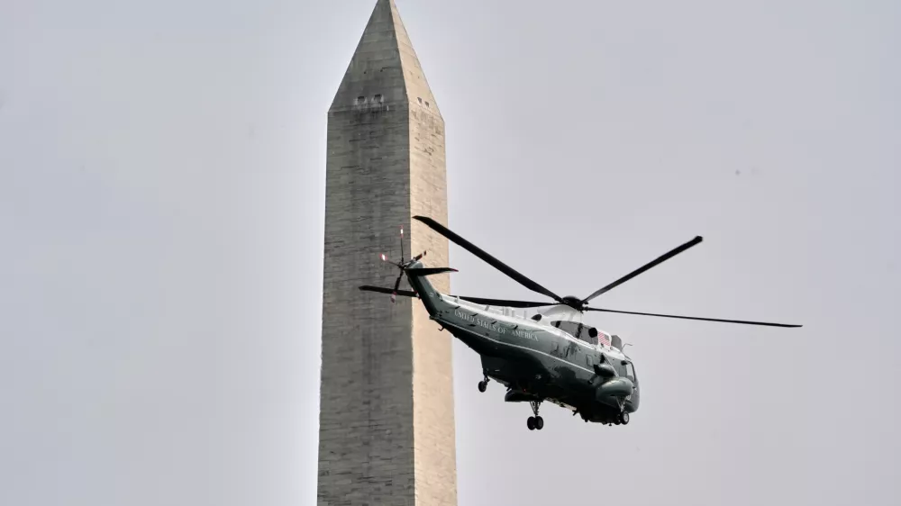 Marine One with President Donald Trump on board lifts off from the Ellipse near the White House and past the Washington Monument, Thursday, Aug. 27, 2026, in Washington, en route to Houston. (AP Photo/Jacquelyn Martin)