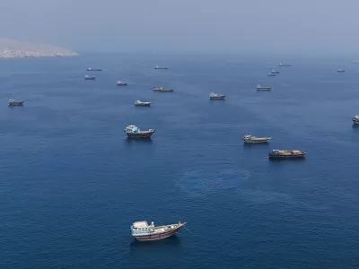 A drone view shows vessels near the Strait of Hormuz, as seen from Musandam, Oman, August 28, 2026. REUTERS/Stringer