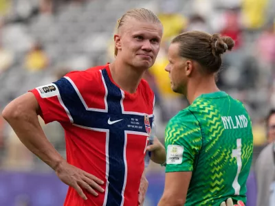Norway's Erling Haaland (9) and Norway goalkeeper Oerjan Nyland (1) celebrate after the World Cup round of 16 soccer match between Brazil and Norway in East Rutherford, N.J., near New York, Sunday, July 5, 2026. (AP Photo/Frank Franklin II)