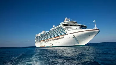 "Eastern Caribbean Sea - February 8, 2010: A luxury cruise ship anchors in the water as passengers are taken by ferry to the local tropical island for a day of sun and fun."
