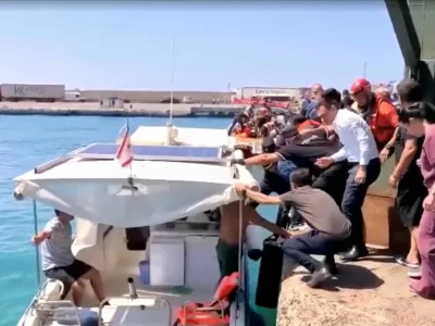 Rescue boats bring passengers to shore from capsized boat in northern Cyprus, August 30, 2026 in this screengrab taken from a video. REUTERS/Reuters TV