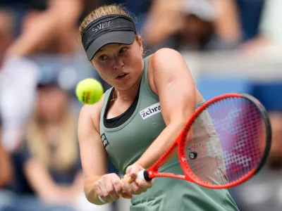 Veronika Erjavec, of Slovenia, returns the ball to Jasmine Paolini, of Italy, during the first round of the U.S. Open tennis championships Sunday, Aug. 30, 2026, in New York. (AP Photo/Yuki Iwamura)