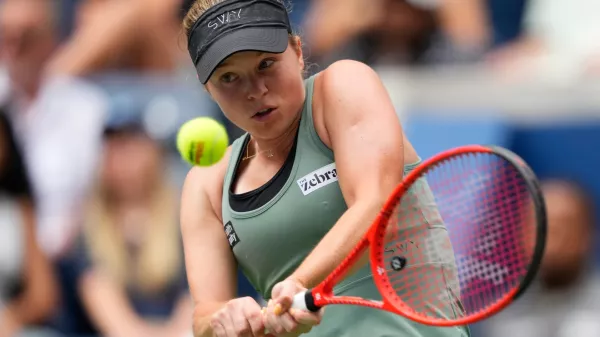 Veronika Erjavec, of Slovenia, returns the ball to Jasmine Paolini, of Italy, during the first round of the U.S. Open tennis championships Sunday, Aug. 30, 2026, in New York. (AP Photo/Yuki Iwamura)