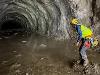 A rescuer works at the entrance of a tunnel at Chilime Hydropower Plant as rescue operations continue for people trapped inside following deadly flash floods and a mudslide, in Rasuwa, Nepal, August 29, 2026, in this screengrab obtained from a social media video. Ashish Gurung/via REUTERS THIS IMAGE HAS BEEN SUPPLIED BY A THIRD PARTY. MANDATORY CREDIT. NO RESALES. NO ARCHIVES. THIS PICTURE WAS CROPPED BY REUTERS TO ENHANCE QUALITY. AN UNCROPPED VERSION HAS BEEN PROVIDED VERIFICATION: - Reuters was able to match the building layout and mountain terrain with topography imagery of the area. - Nepal National Mountain Guide Association have said they are conducting rescue operations at the tunnel.