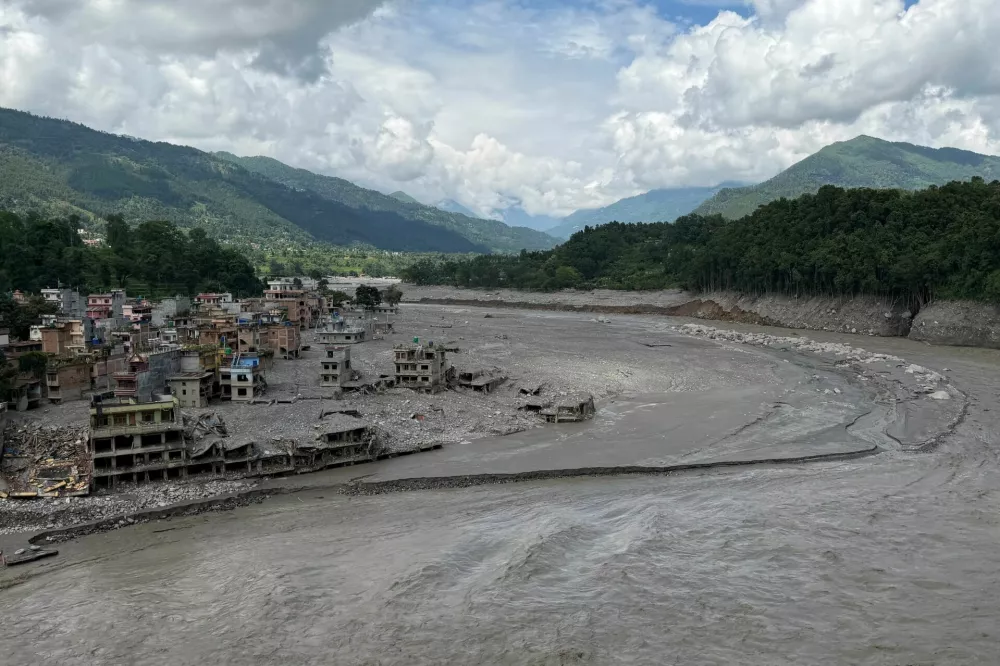 Damaged properties along the Trishuli River where the Tribhuvan Trishuli Secondary School once stood, before it was destroyed by deadly flash floods and mudslides, in Nuwakot, Nepal, August 31, 2026. Picture taken with a mobile phone. REUTERS/Sunil Kataria