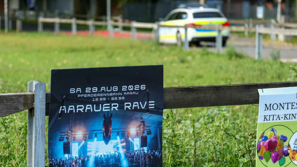 A poster for the rave party on display near the Schachen horse racing track, following a deadly shooting incident at a rave party on Sunday, in Aarau, Switzerland, August 31, 2026. REUTERS/Denis Balibouse