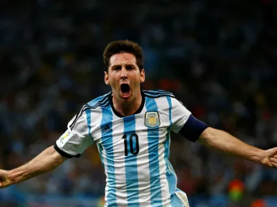 FILE PHOTO: Argentina's Lionel Messi celebrates scoring a goal during the 2014 World Cup Group F soccer match against Bosnia and Herzegovina at the Maracana stadium in Rio de Janeiro June 15, 2014. REUTERS/Michael Dalder/File Photo