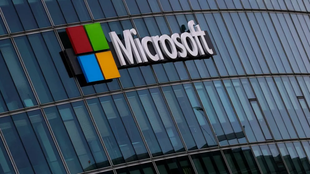 FILE PHOTO: A view shows a Microsoft logo at Microsoft offices in Issy-les-Moulineaux near Paris, France, March 21, 2025. REUTERS/Gonzalo Fuentes/File Photo