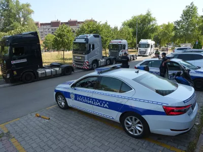 Serbian police guard the EU delegation building during a protest by truckers against travel bans imposed on Balkan truck drivers to work in European Union countries, in Belgrade, Serbia, Monday, Aug. 31, 2026. (AP Photo/Darko Vojinovic)