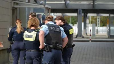 Police officers are stationed near Augsburg's main train station in Augsburg, Germany, Wednesday, Sept. 2, 2026. (Felix Kirberg/dpa via AP)