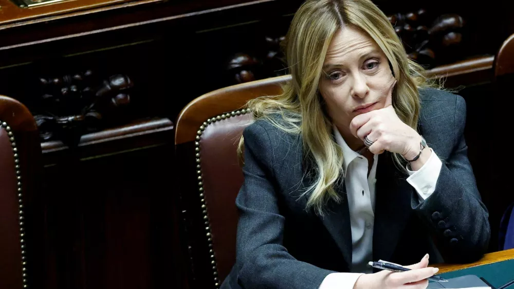 FILE PHOTO: Italy's Prime Minister Giorgia Meloni listens to debate, after she reported on her government's actions and is expected to speak on the latest developments in Iran, at the lower house of Parliament in Rome, Italy, April 9, 2026. REUTERS/Remo Casilli/File Photo