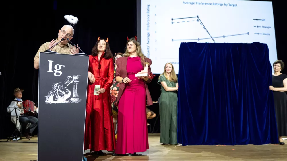 Peace Prize winners, from left, Daniel Sznycer, Keelah Williams and Jaimie Arona Krems, speak during the Ig Nobel Prize ceremony held in the Zurich Convention Center in Zurich, Switzerland, on Thursday, Sept. 3, 2026. (Claudio Thoma/Keystone via AP)