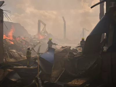 Firefighters try to extinguish a fire at a partially destroyed warehouse after a Russian drone attack in Brovary on the outskirts of Kyiv, Ukraine, Friday, Sept. 4, 2026. (AP Photo/Francisco Seco)