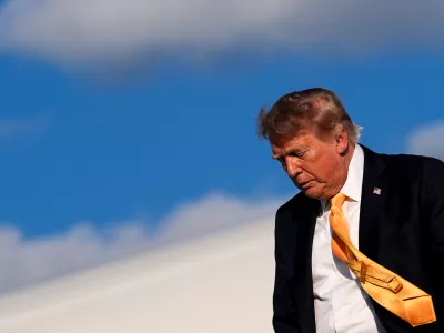 President Donald Trump disembarks Air Force One at Morristown Airport, Friday, Sept. 4, 2026, in Morristown, N.J. (AP Photo/Julia Demaree Nikhinson)