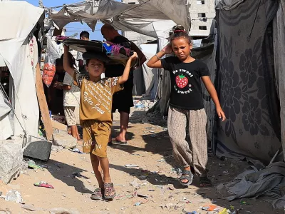 Palestinian children walk at a tent camp sheltering displaced people, in Gaza City, September 4, 2026. REUTERS/Dawoud Abu Alkas